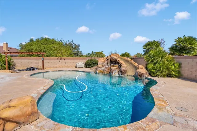 a view of a swimming pool with an outdoor space