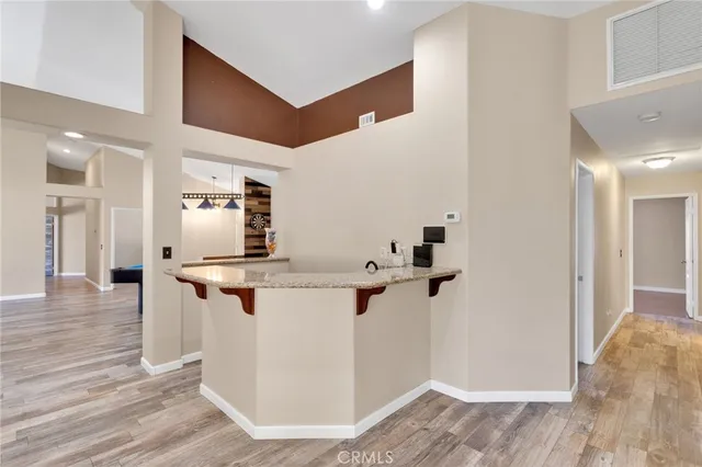 a kitchen with stainless steel appliances a sink and a refrigerator