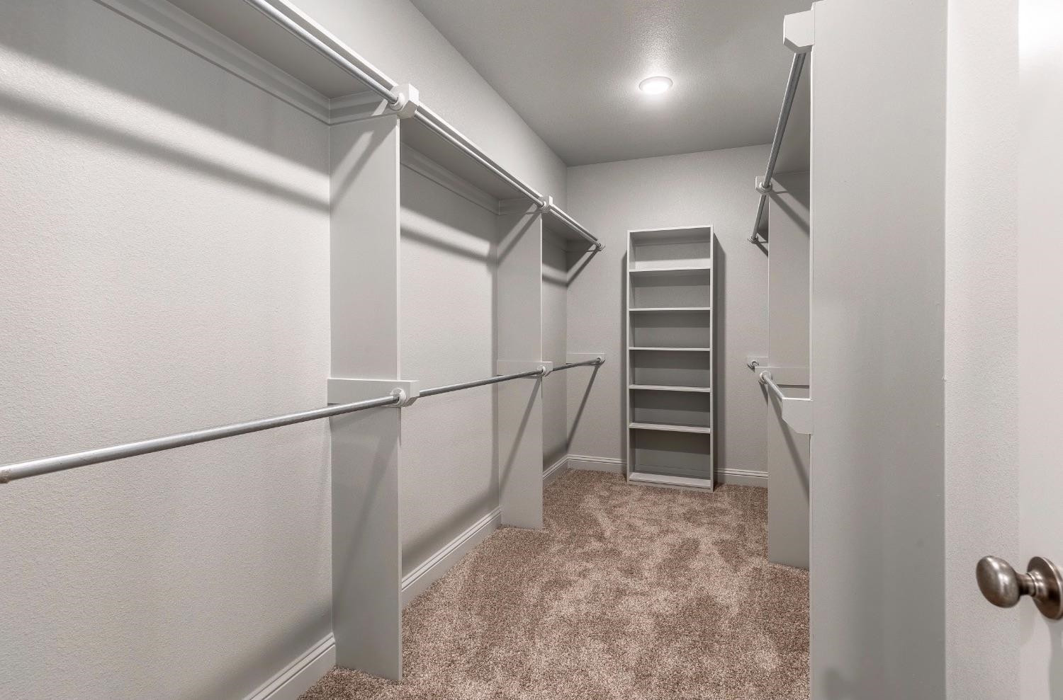 2726 138th Street Lubbock, TX 79423 - Photo 11 of 18 a view of walk in closet with empty racks