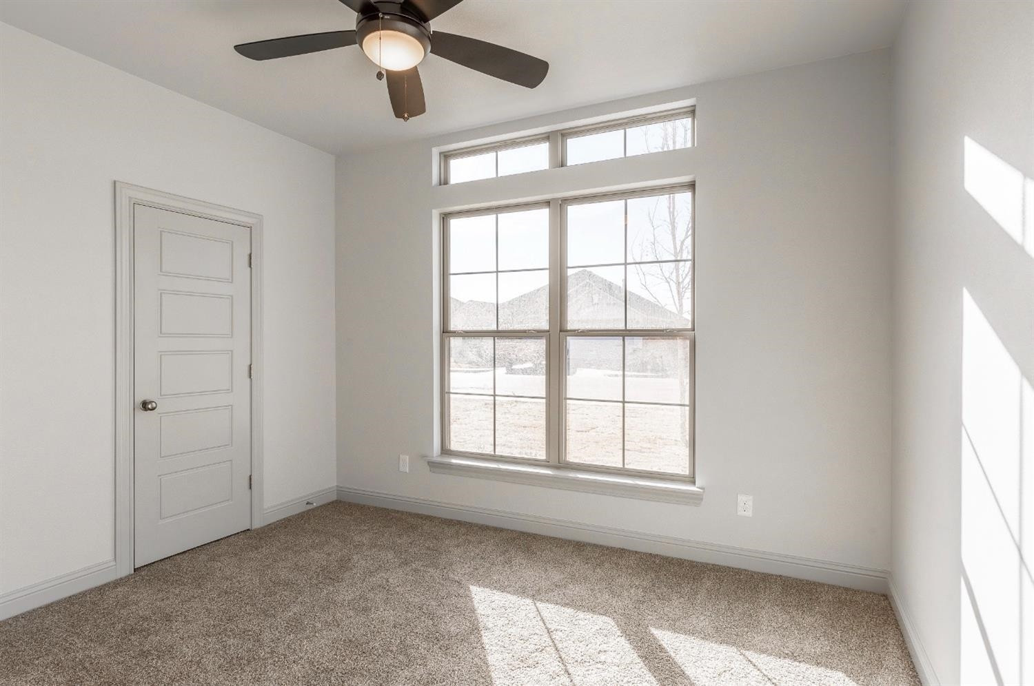 2726 138th Street Lubbock, TX 79423 - Photo 12 of 18 a view of an empty room with a window