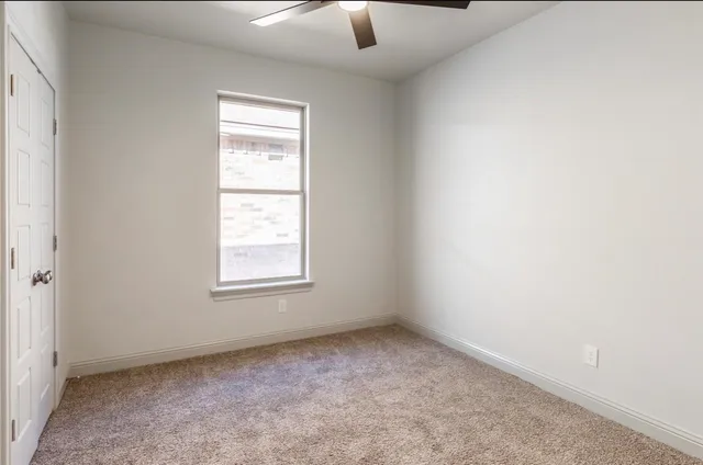 a view of walk in closet with empty room