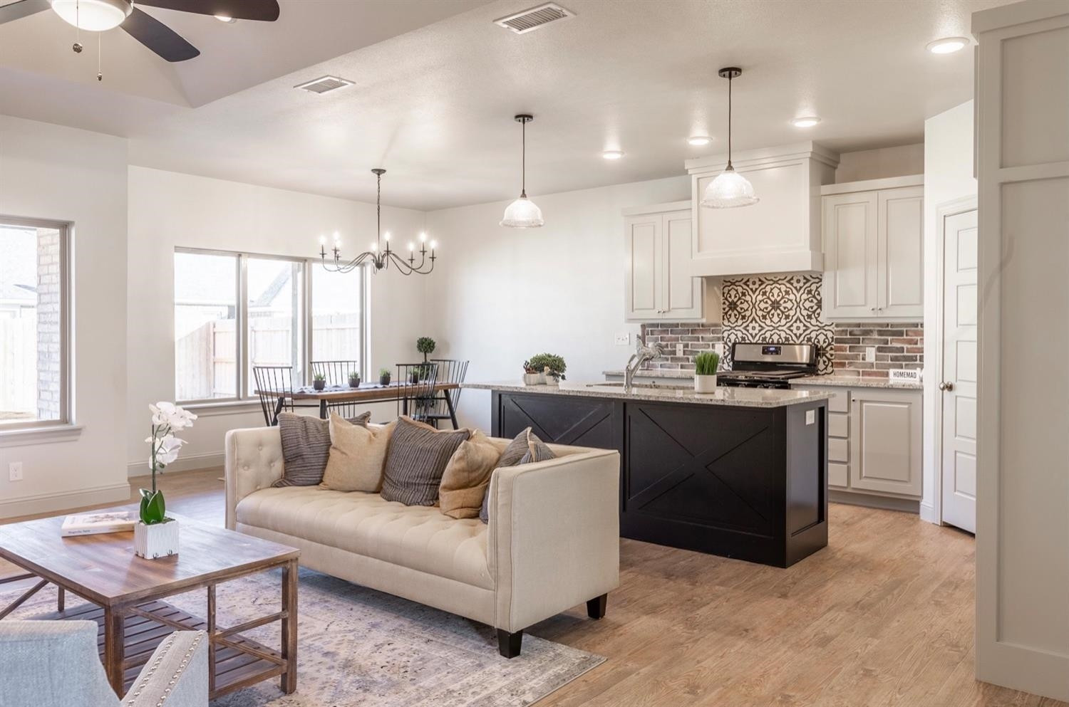 2726 138th Street Lubbock, TX 79423 - Photo 5 of 18 a view of kitchen with kitchen island stainless steel appliances living room living room and windows