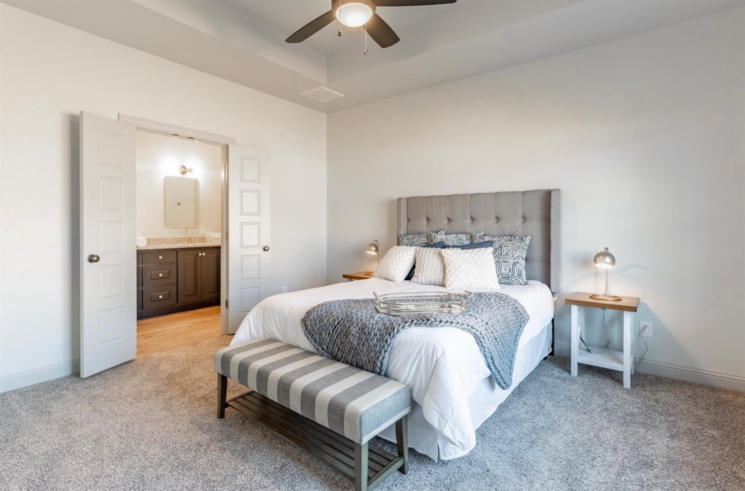 2726 138th Street Lubbock, TX 79423 - Photo 8 of 18 a spacious bedroom with a bed and a chandelier