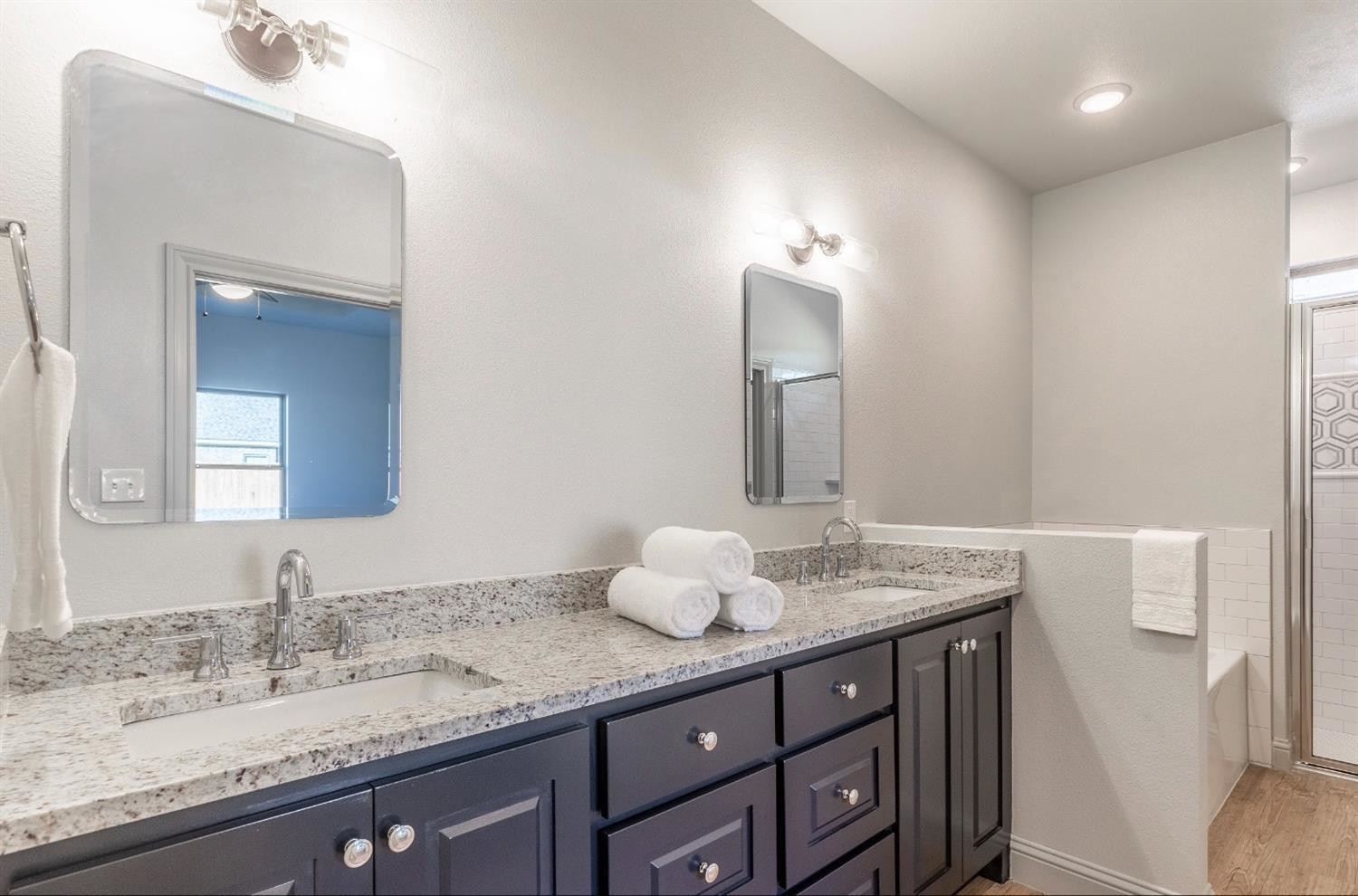 2726 138th Street Lubbock, TX 79423 - Photo 9 of 18 a bathroom with a granite countertop sink and a mirror