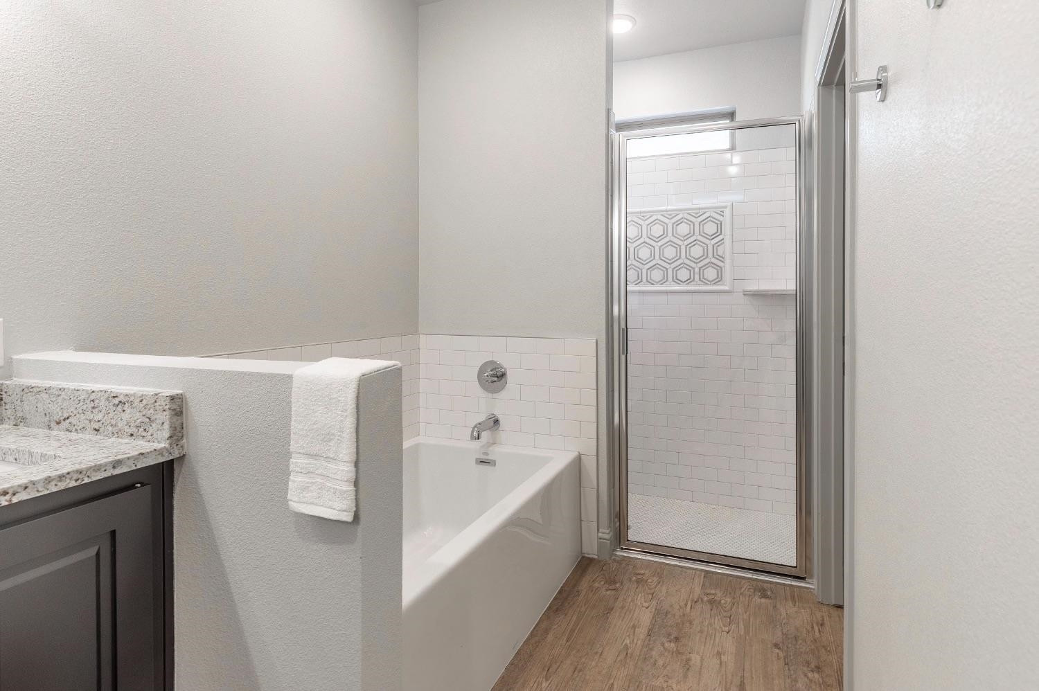 2726 138th Street Lubbock, TX 79423 - Photo 10 of 18 a bathroom with a tub and a sink