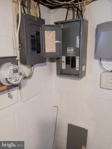 a bathroom with a granite countertop sink a mirror and shower