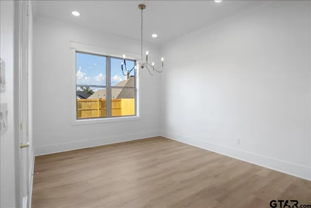 an empty room with windows and entrance