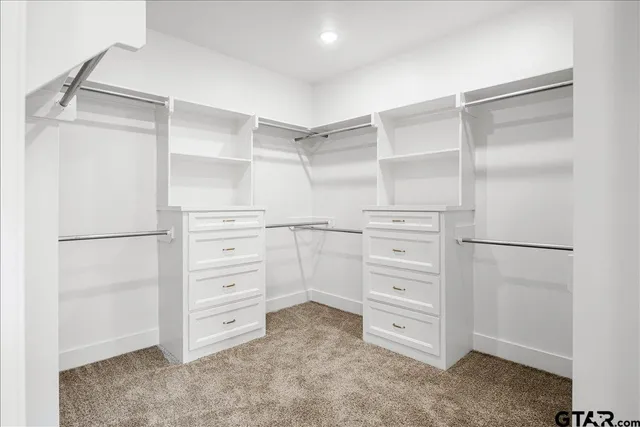 a white toilet sitting next to a sink