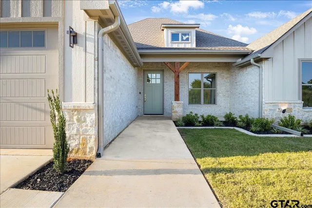 a view of a house with a garden