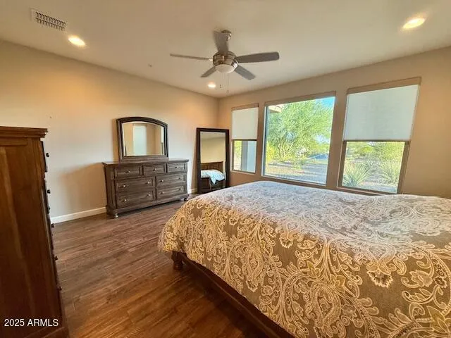 a bathroom with a double vanity sink and mirror with shower