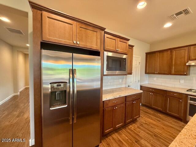 17259 East Woolsey Way Rio Verde, AZ 85263 - Photo 7 of 28 a kitchen with stainless steel appliances granite countertop a refrigerator a sink and a microwave