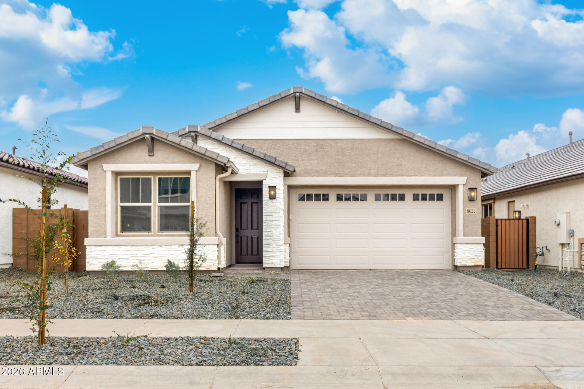 a view of a house with a yard and garage