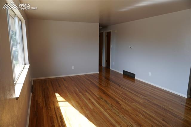 6 North Chelton Road Colorado Springs, CO 80909 - Photo 2 of 30 Beautiful hardwood floors in living room