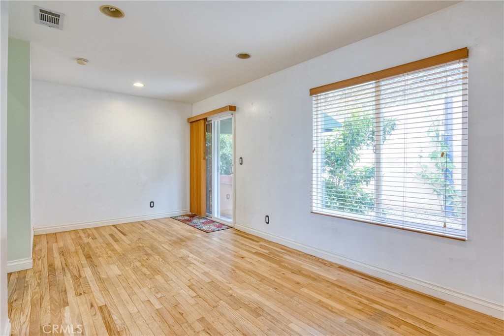 591 Devonwood Road Altadena, CA 91001 - Photo 29 of 51 a view of an empty room with wooden floor and a window