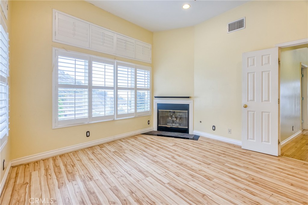 591 Devonwood Road Altadena, CA 91001 - Photo 41 of 51 a view of an empty room with wooden floor and a window