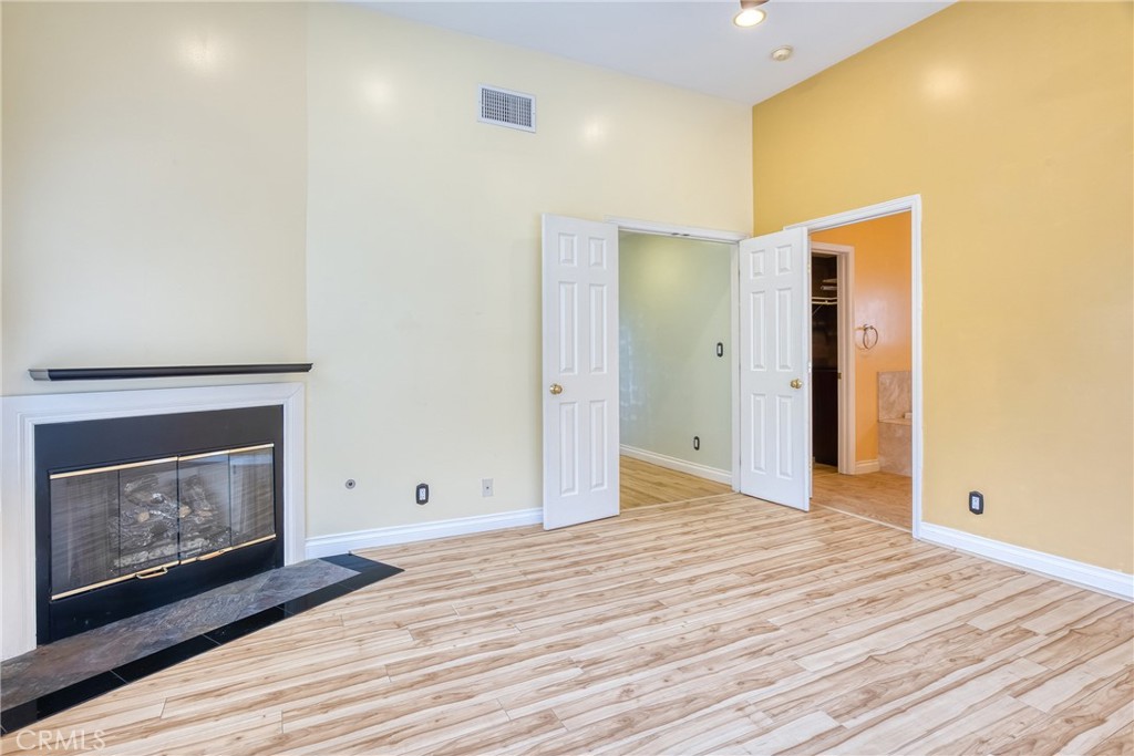 591 Devonwood Road Altadena, CA 91001 - Photo 42 of 51 a view of empty room with wooden floor and fireplace