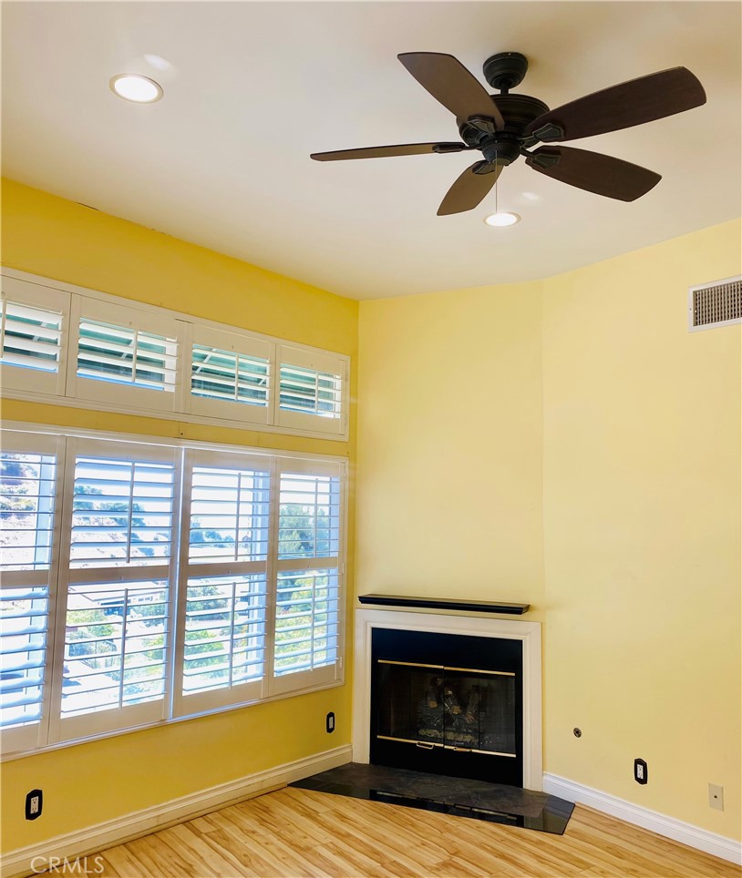 591 Devonwood Road Altadena, CA 91001 - Photo 43 of 51 a living room with a fireplace and a large window