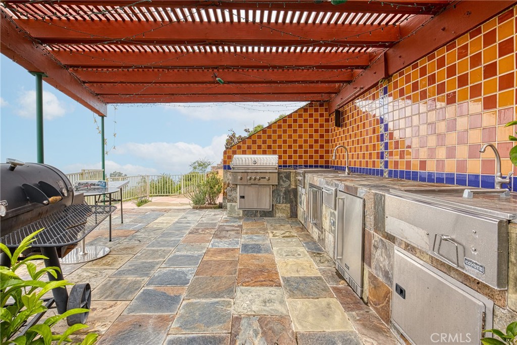 591 Devonwood Road Altadena, CA 91001 - Photo 5 of 51 a building with glass top table and chairs
