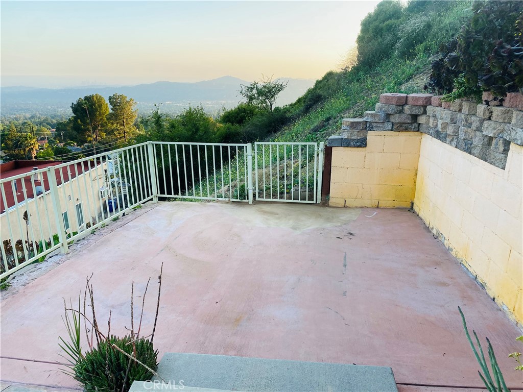 591 Devonwood Road Altadena, CA 91001 - Photo 8 of 51 a view of a garden with wooden fence