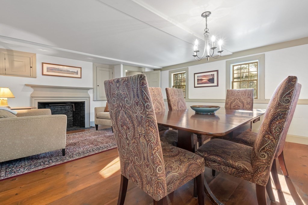 11 Boxford Road Topsfield, MA 01983 - Photo 12 of 34 a living room with furniture a fireplace and a chandelier