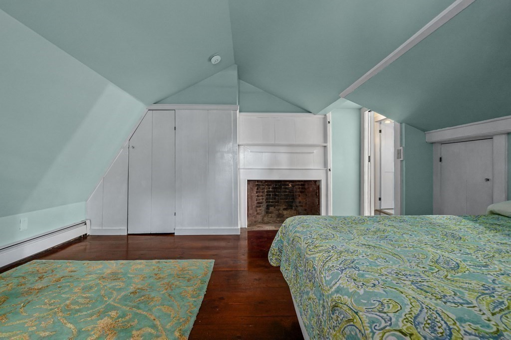 11 Boxford Road Topsfield, MA 01983 - Photo 23 of 34 a bed sitting in a spacious bedroom next to a fireplace