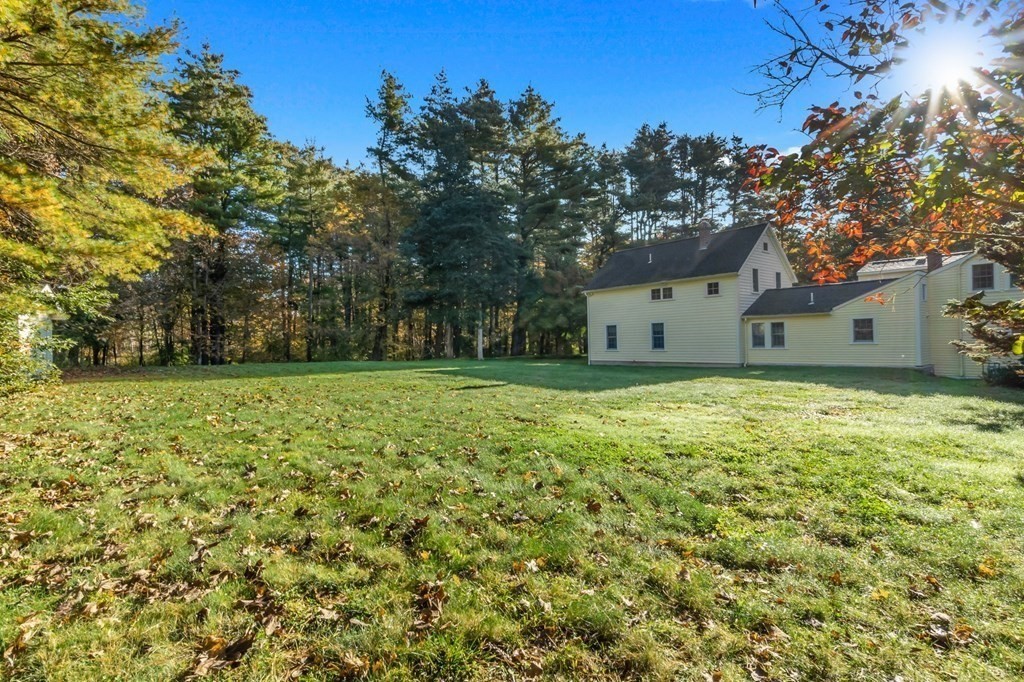 11 Boxford Road Topsfield, MA 01983 - Photo 4 of 34 a house view with a garden