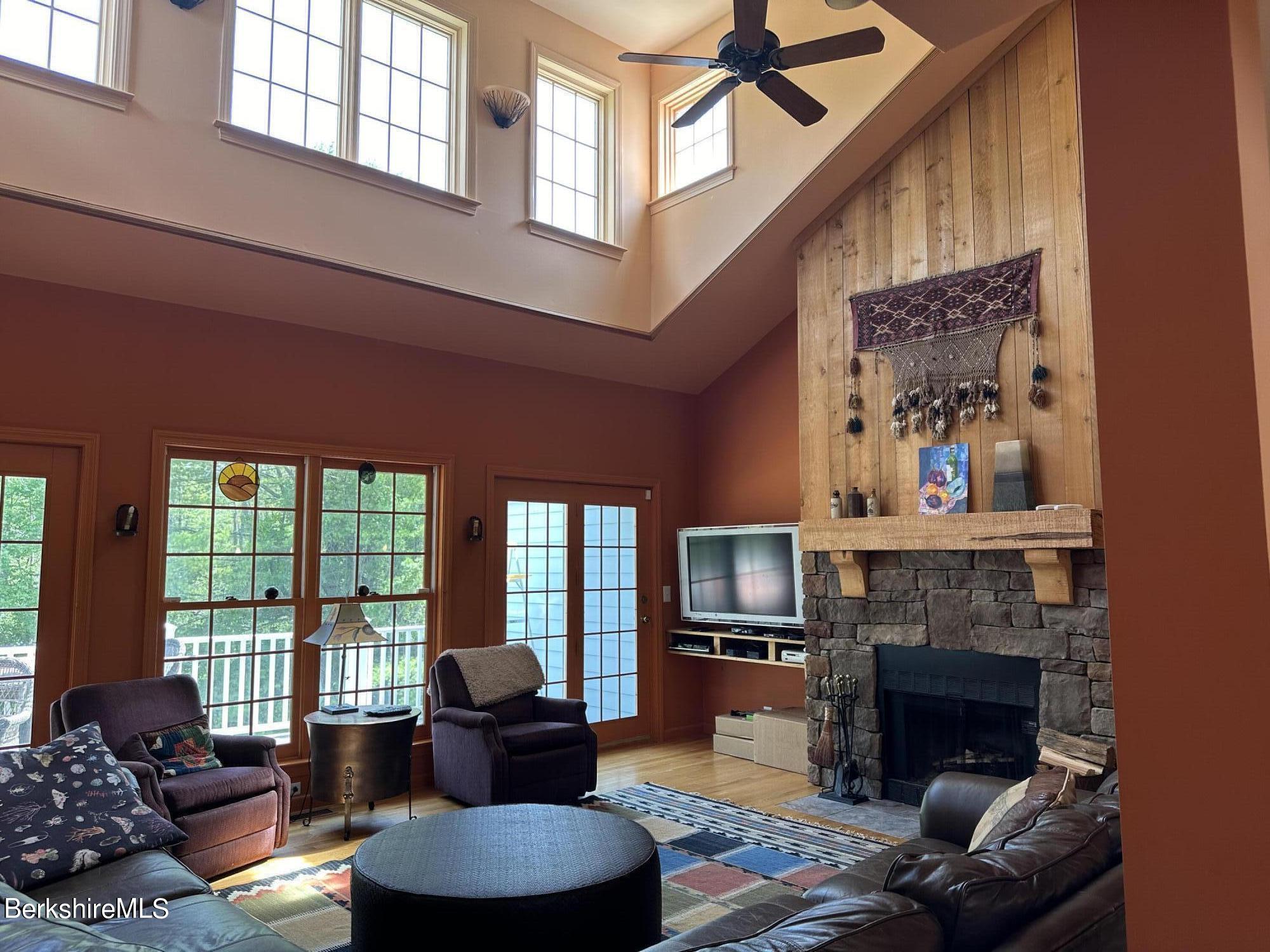 1136 Barker Road, Unit 66 Pittsfield, MA 01201 - Photo 1 of 33 a living room with furniture fireplace and a large window