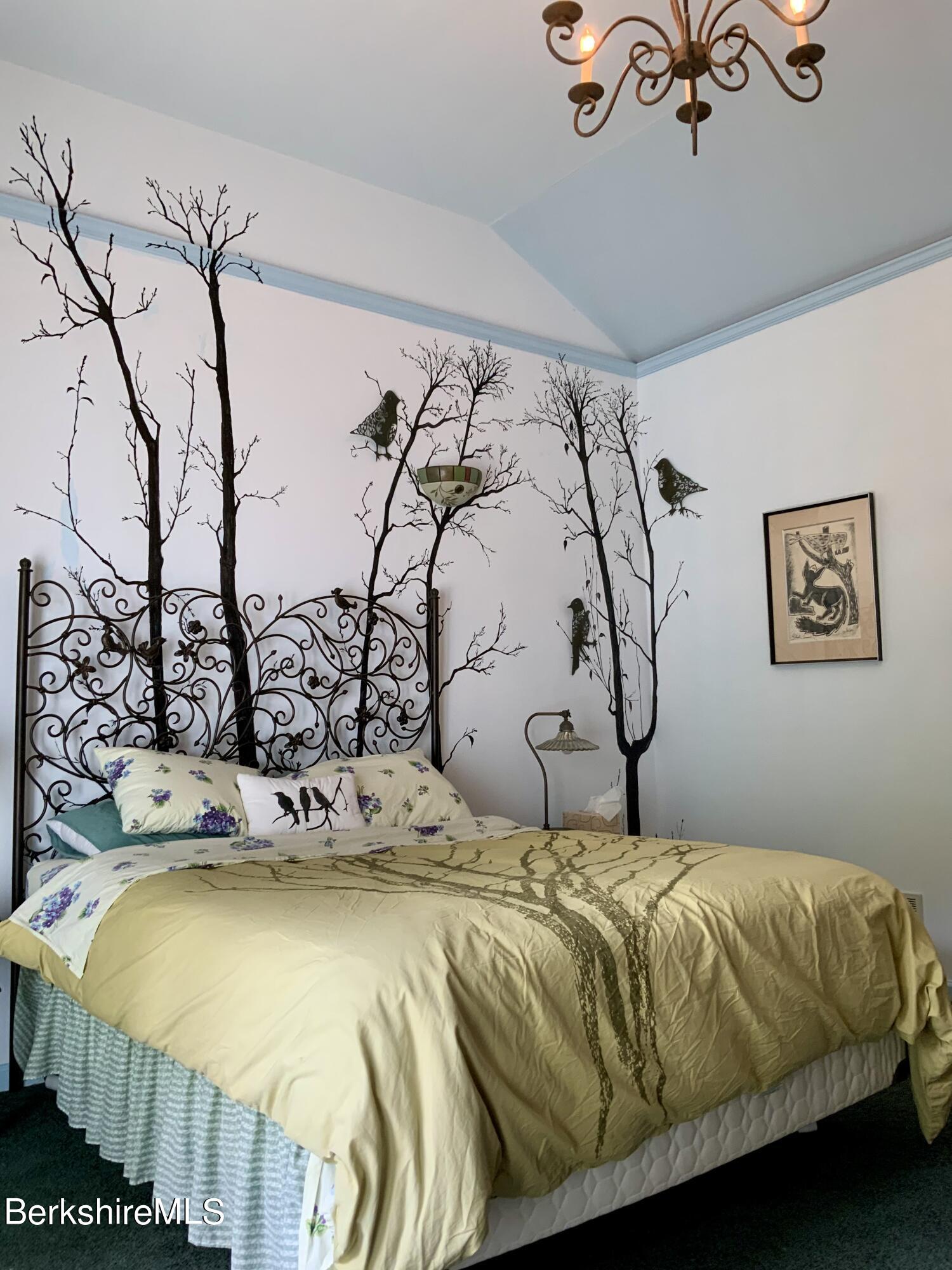1136 Barker Road, Unit 66 Pittsfield, MA 01201 - Photo 15 of 33 a bedroom with a bed and painting on the wall