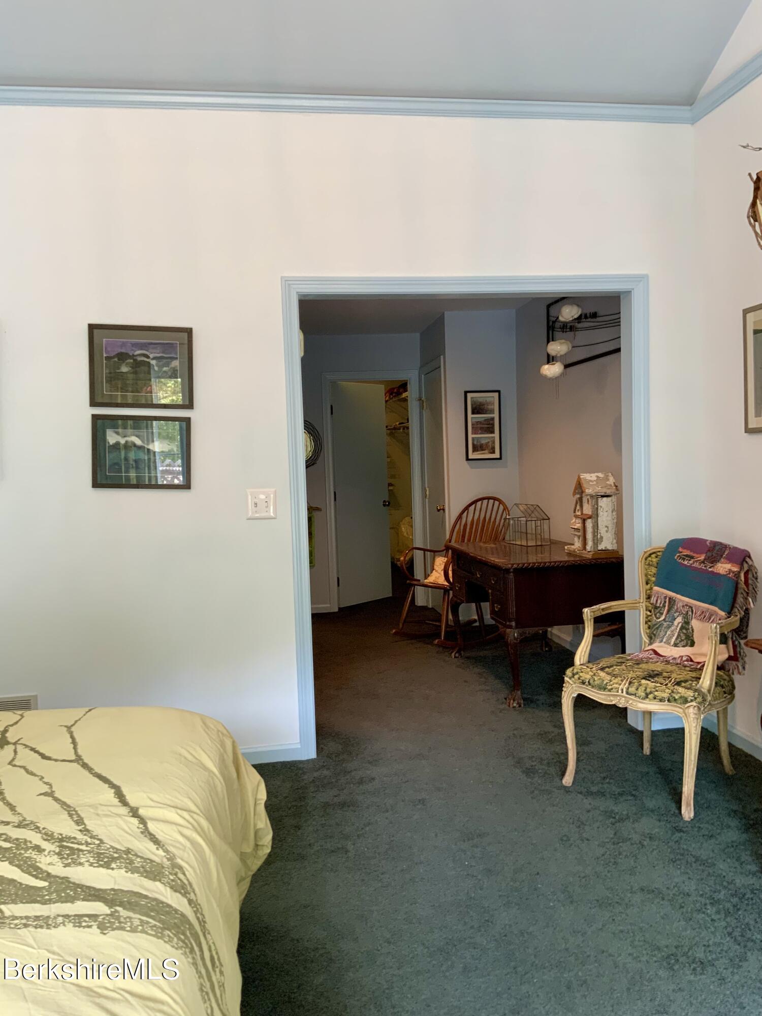 1136 Barker Road, Unit 66 Pittsfield, MA 01201 - Photo 16 of 33 a bed room with furniture and a chair
