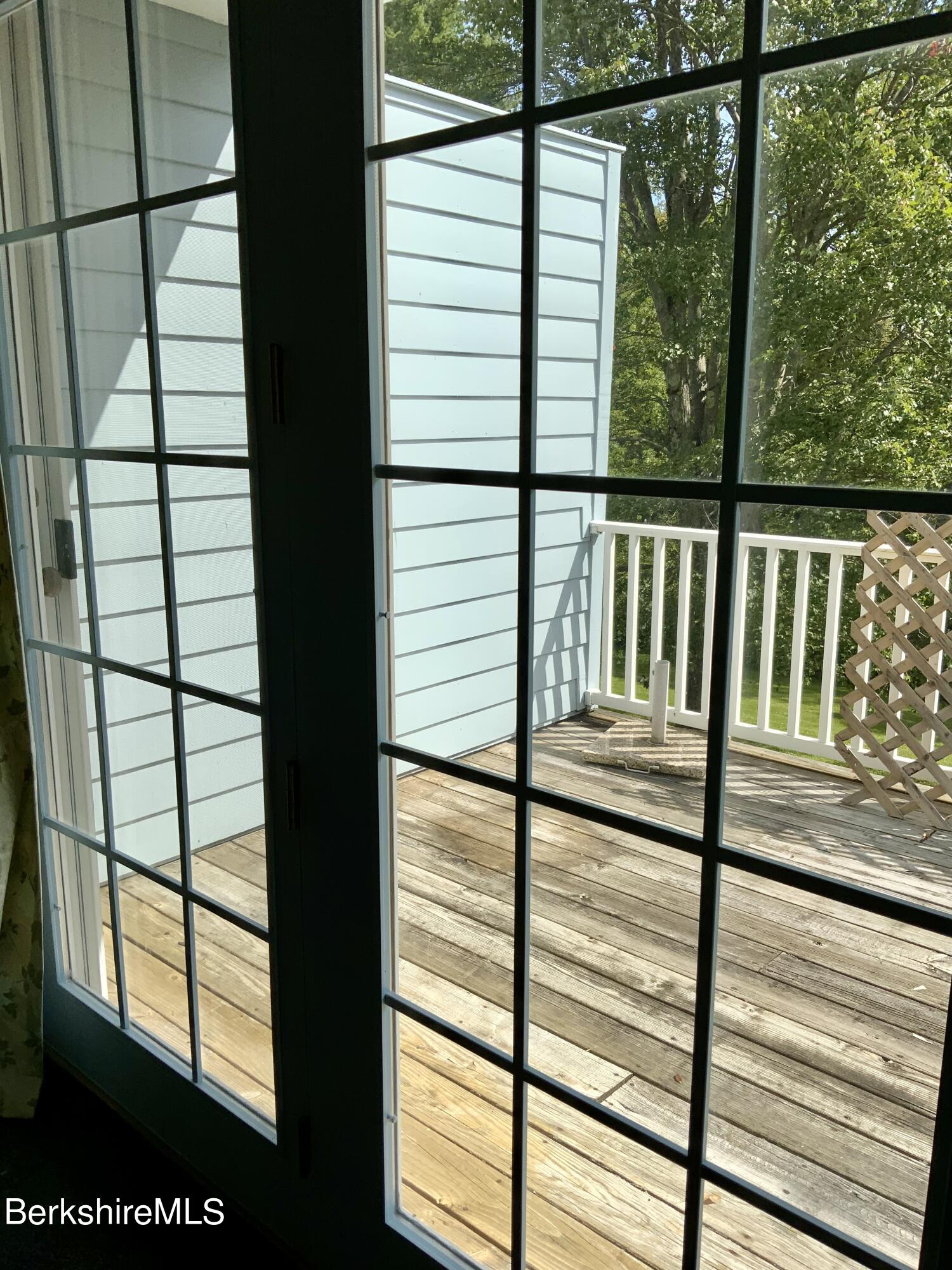 1136 Barker Road, Unit 66 Pittsfield, MA 01201 - Photo 17 of 33 a view of a balcony from a window
