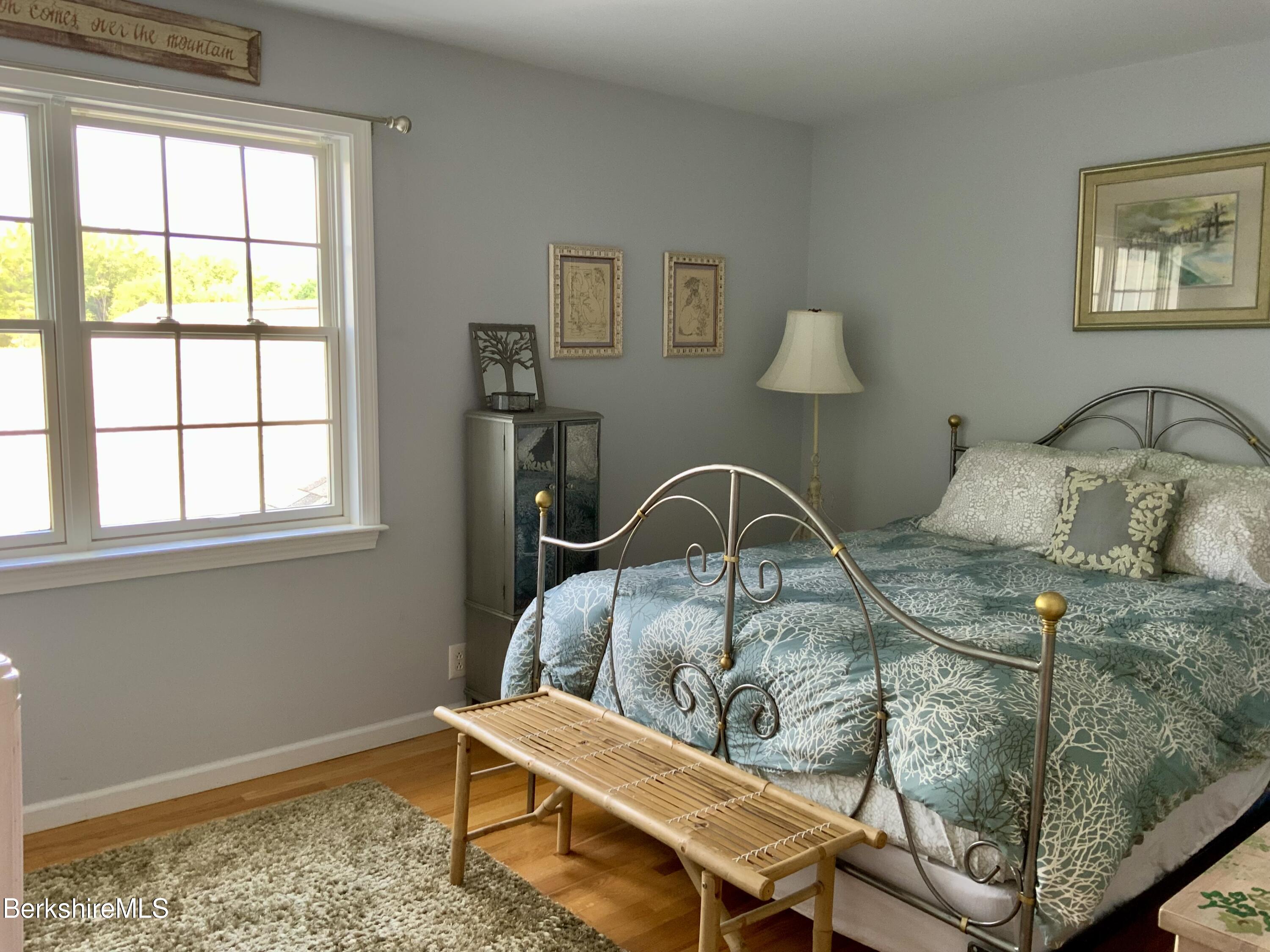 1136 Barker Road, Unit 66 Pittsfield, MA 01201 - Photo 23 of 33 a room with a table chairs and a window