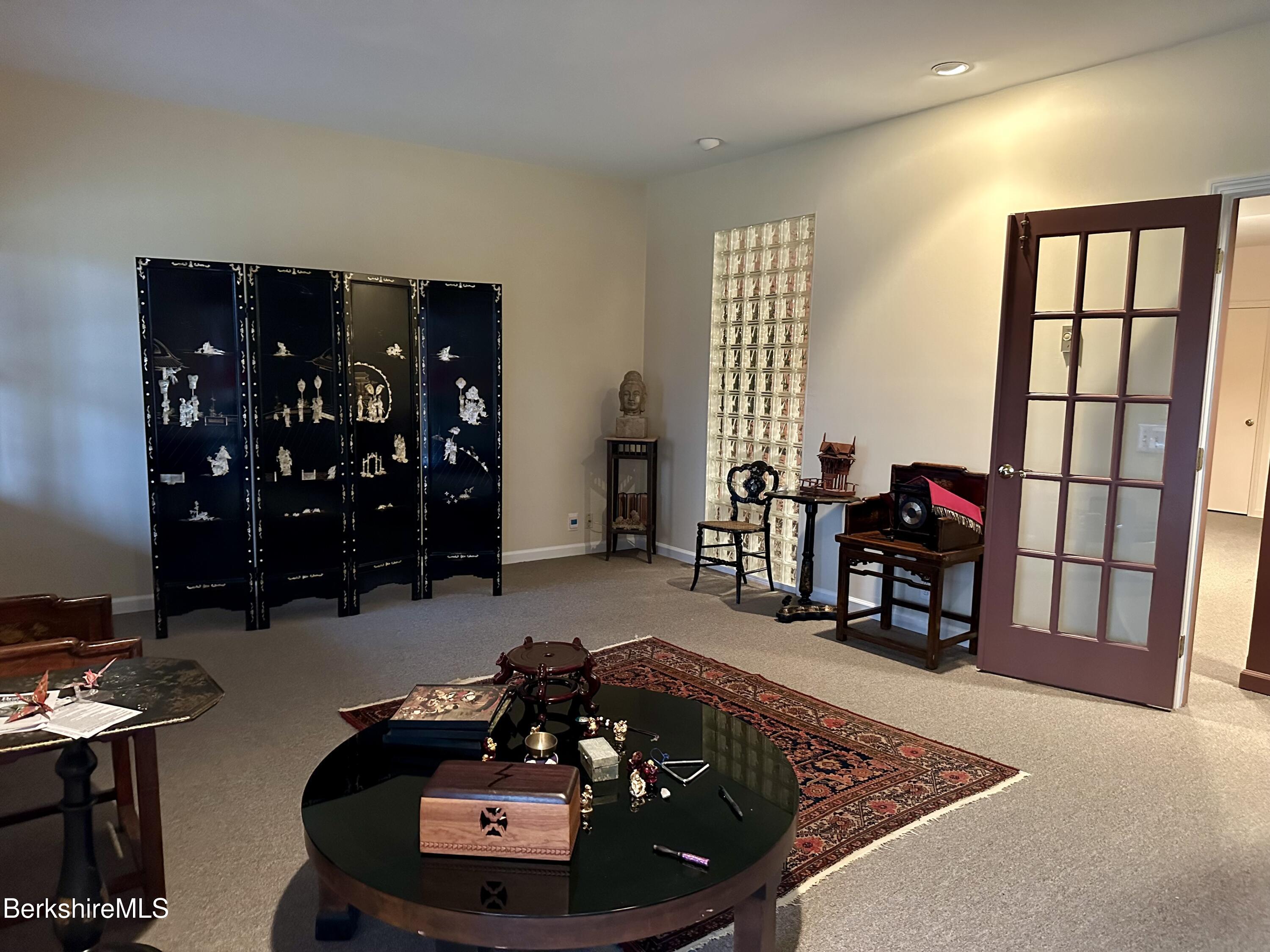 1136 Barker Road, Unit 66 Pittsfield, MA 01201 - Photo 28 of 33 a room with furniture and a potted plant