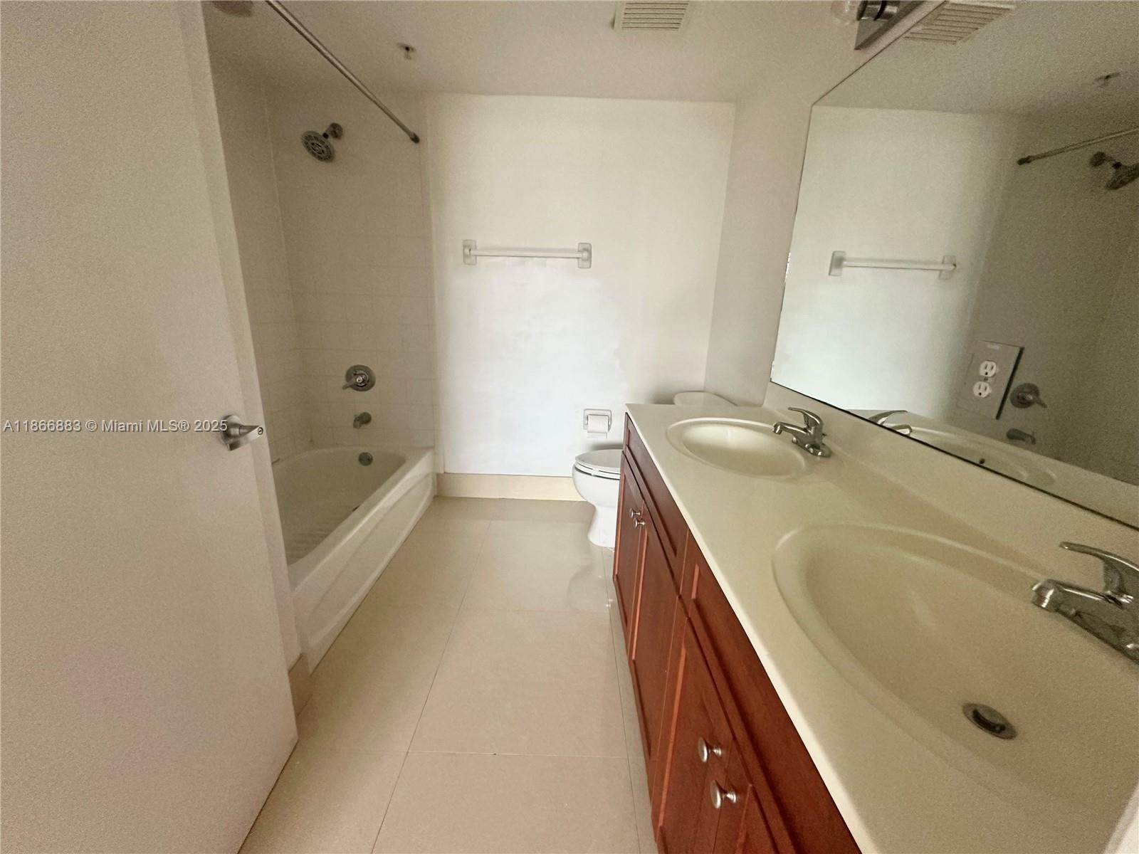 36 Northwest 6th Avenue, Unit 806 Miami, FL 33128 - Photo 15 of 23 a bathroom with a tub sink and mirror
