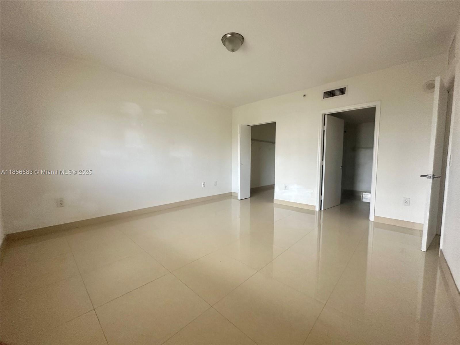36 Northwest 6th Avenue, Unit 806 Miami, FL 33128 - Photo 18 of 23 an empty room with a natural light