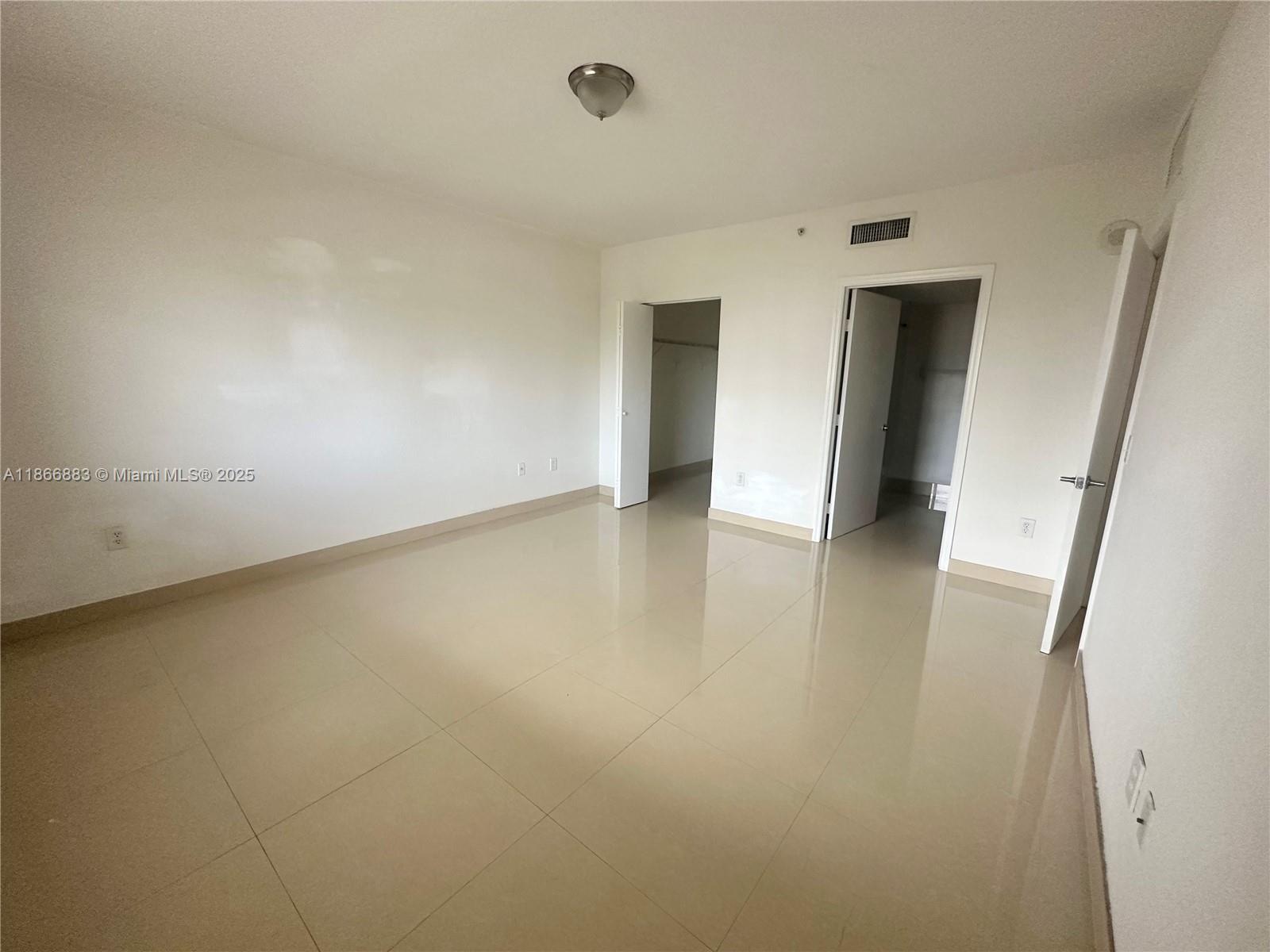 36 Northwest 6th Avenue, Unit 806 Miami, FL 33128 - Photo 19 of 23 an empty room with wooden floor and entrance