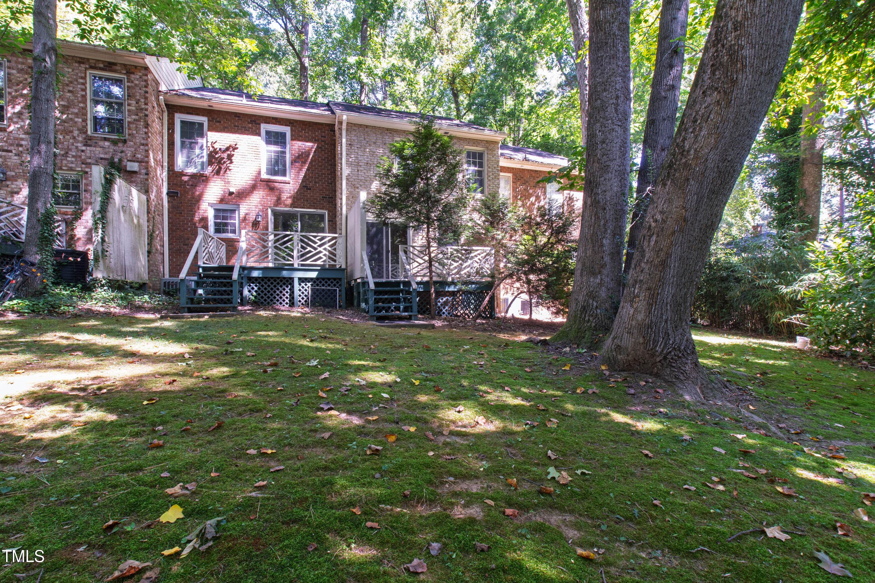 409 Smith Avenue, Unit 102 Chapel Hill, NC 27516 - Photo 30 of 35 a view of a house with a tree in a yard