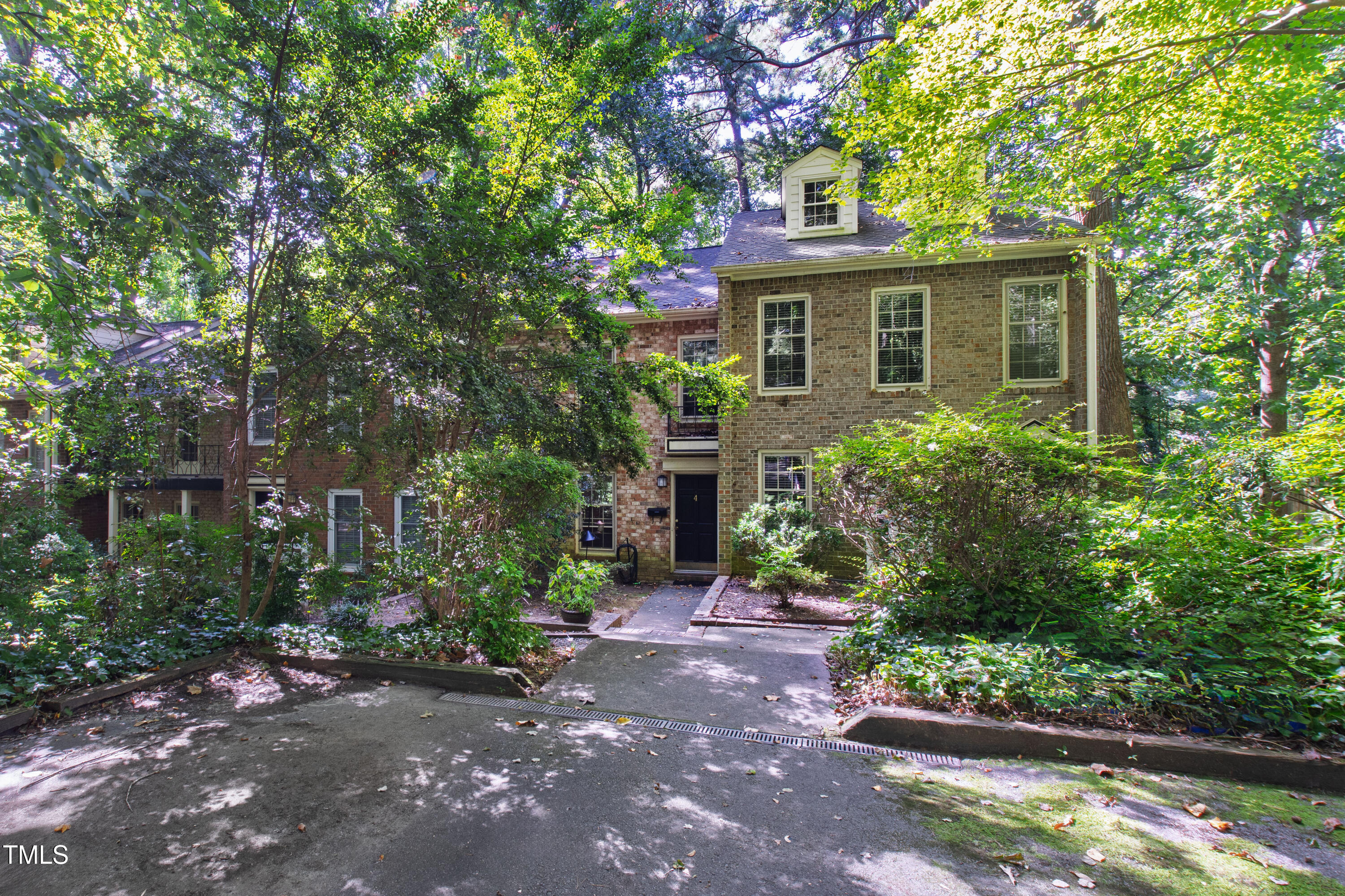 409 Smith Avenue, Unit 102 Chapel Hill, NC 27516 - Photo 34 of 35 a front view of a house with a yard and a garden