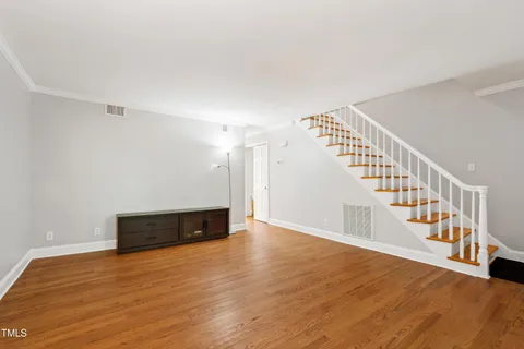 a view of an entryway with wooden floor