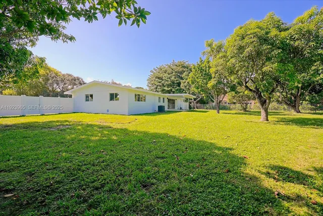 a view of a swimming pool with an outdoor space and seating area