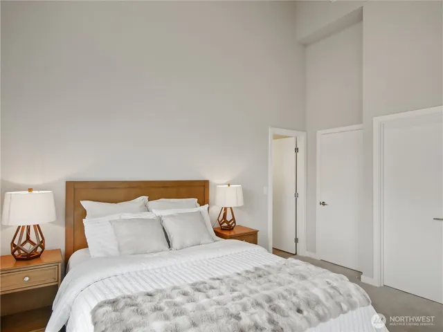 a bedroom with a bed and a couch