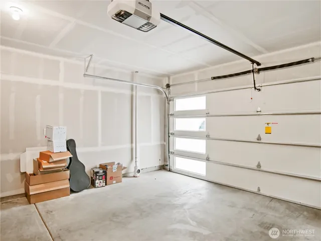 a bedroom with furniture and white walls