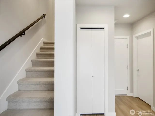 a view of entryway with bedroom and stairs