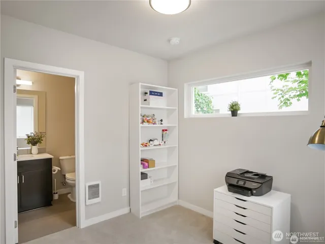 a kitchen with a refrigerator and a stove