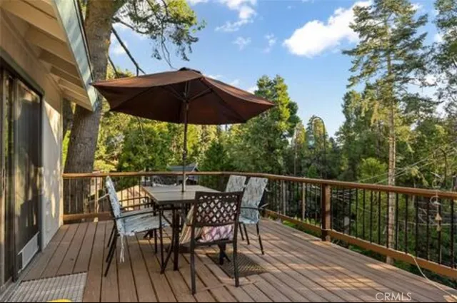 a view of balcony with furniture and wooden floor