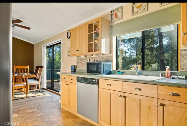 a kitchen with stainless steel appliances granite countertop a stove and a sink