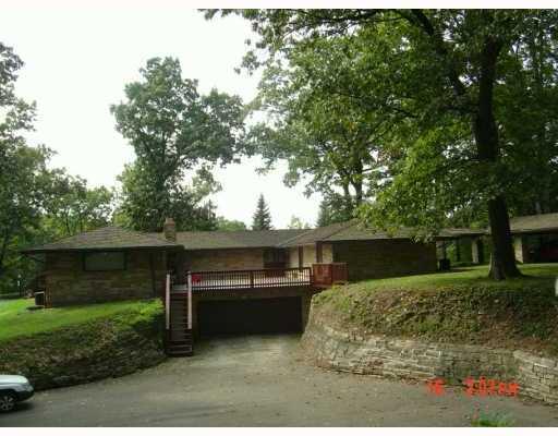 7686 Ridge Road Natrona Heights, PA 15065 - Photo 2 of 8 Land/Lot. PARKING AREA HAS A BASKETBALL HOOP. NOTE LARGE CERAMIC-TIME PATIO ABOVE 5-CAR GARAGE.