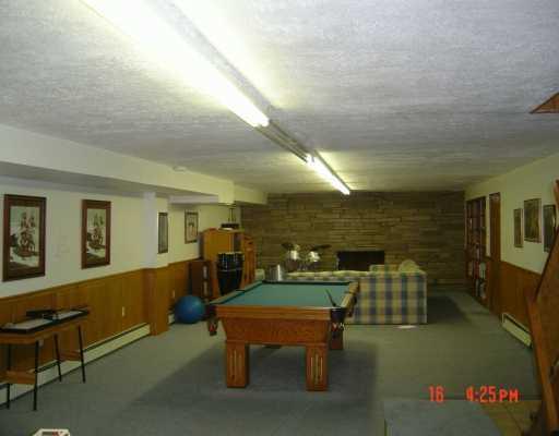7686 Ridge Road Natrona Heights, PA 15065 - Photo 5 of 8 Den/Family/Great Room. A 58X17 DOWNSTAIRS FAMILY ROOM. THIS IS ONLY ONE SIDE OF THE PHOTO. THERE IS A PING PONG TABLE BEHIND