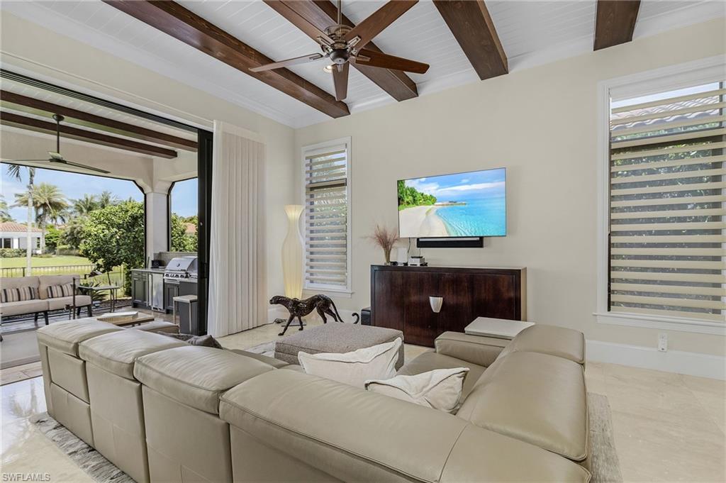 2220 Residence Circle Naples, FL 34105 - Photo 14 of 50 Living area featuring a ceiling fan and beam ceiling
