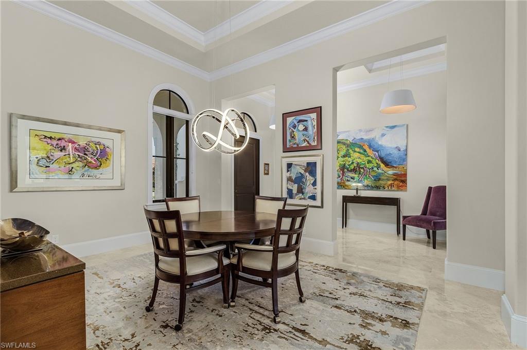 2220 Residence Circle Naples, FL 34105 - Photo 16 of 50 Dining room featuring crown molding and light marble finish flooring