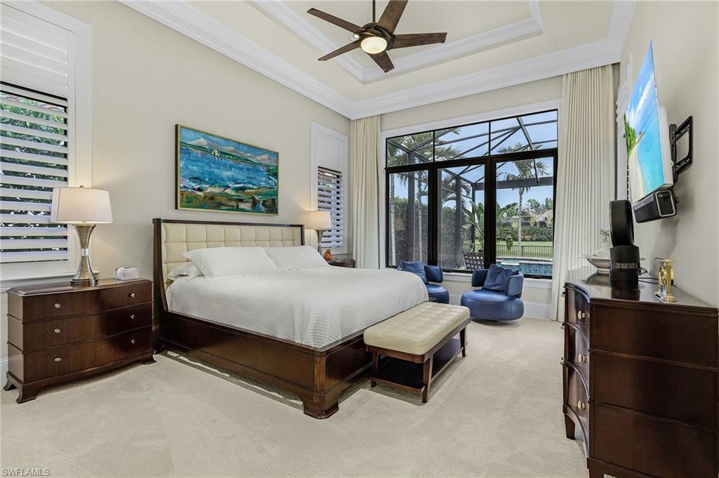2220 Residence Circle Naples, FL 34105 - Photo 18 of 50 Carpeted bedroom with ceiling fan, crown molding, a raised ceiling, and a sunroom